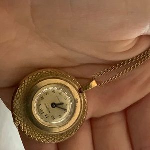Swiss made watchpendant,little worn but not much damage-not sure if clock works